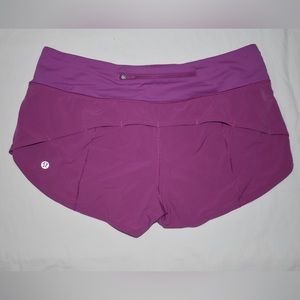 size 4 Lululemon Speed-Up Shorts in purple/pink.